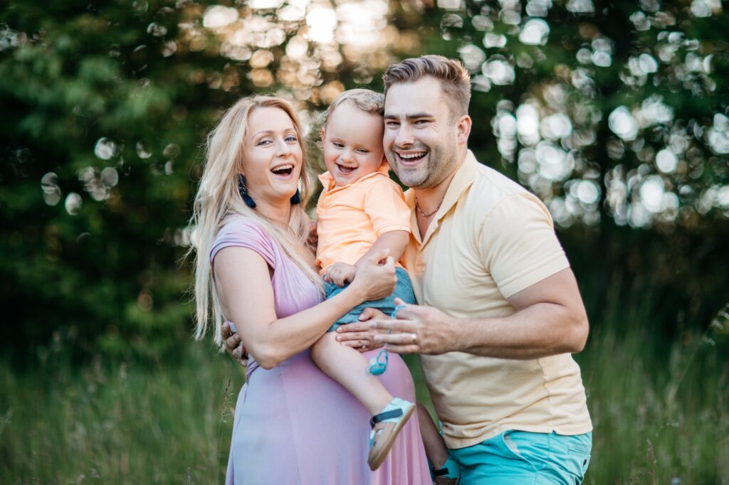 A happy family having fun together outside in the nature.