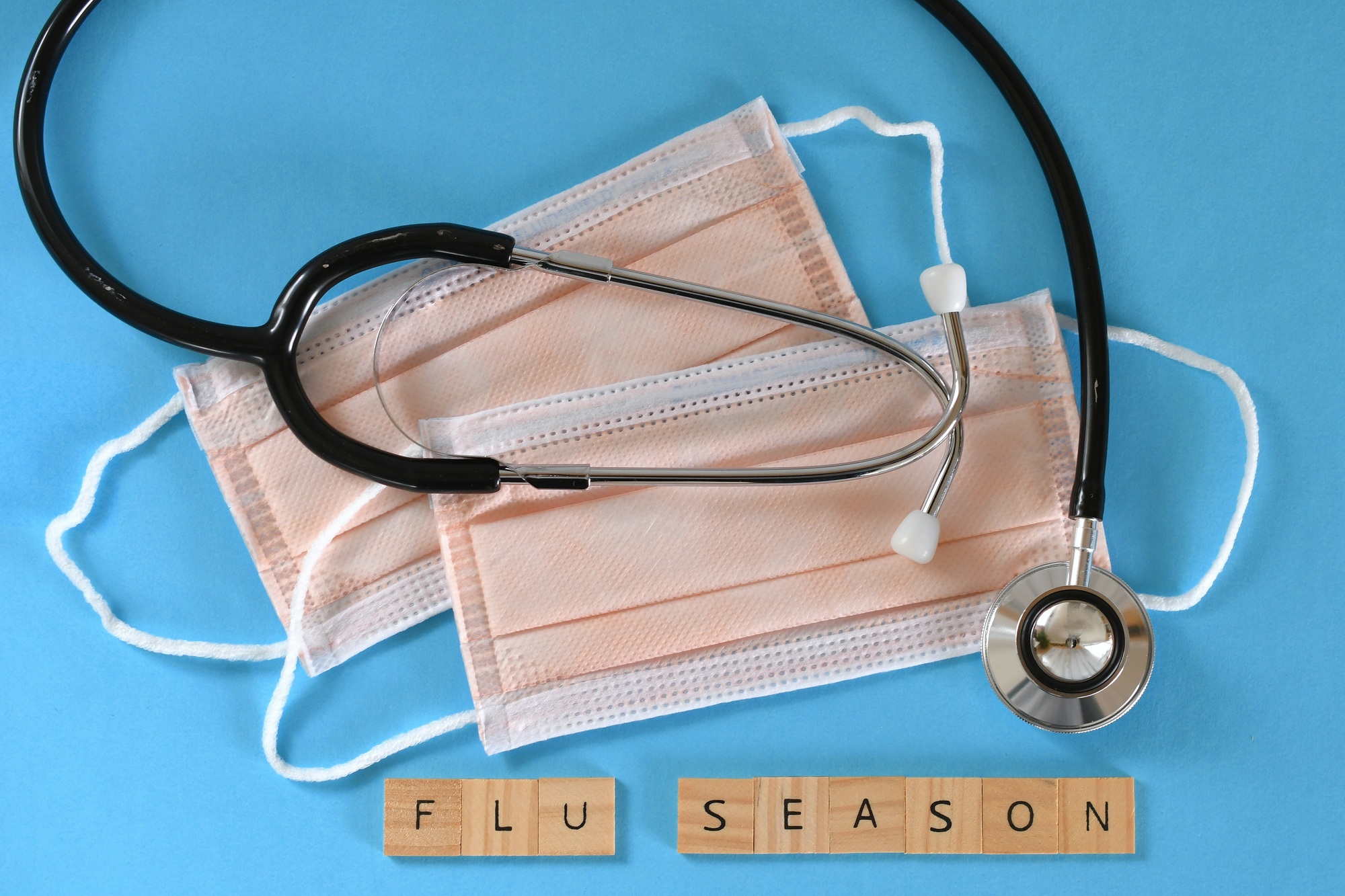 Staying healthy during Flu Season - Medical surgical face mask masks with stethoscope
